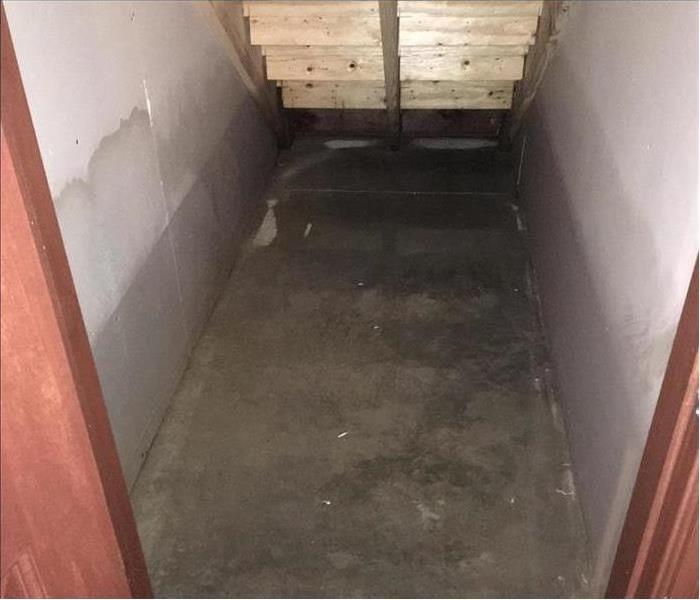 water damage on closed under stairs